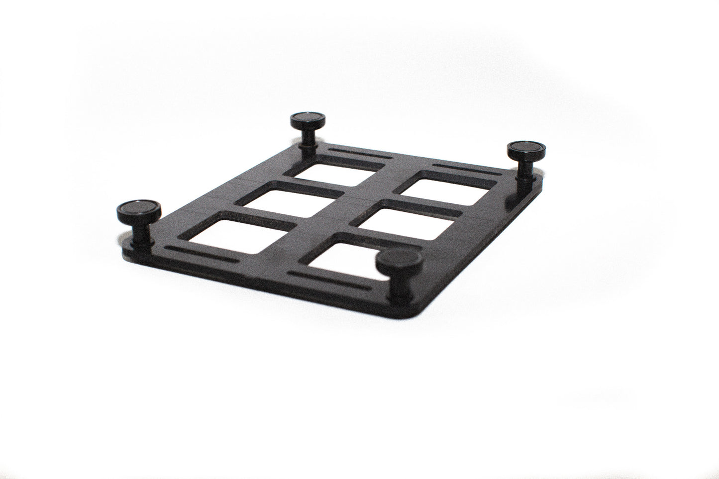 6-slot ABS MOLLE panel flipped upside down to show the magnetic mounting feet attached for securing to metal surfaces.