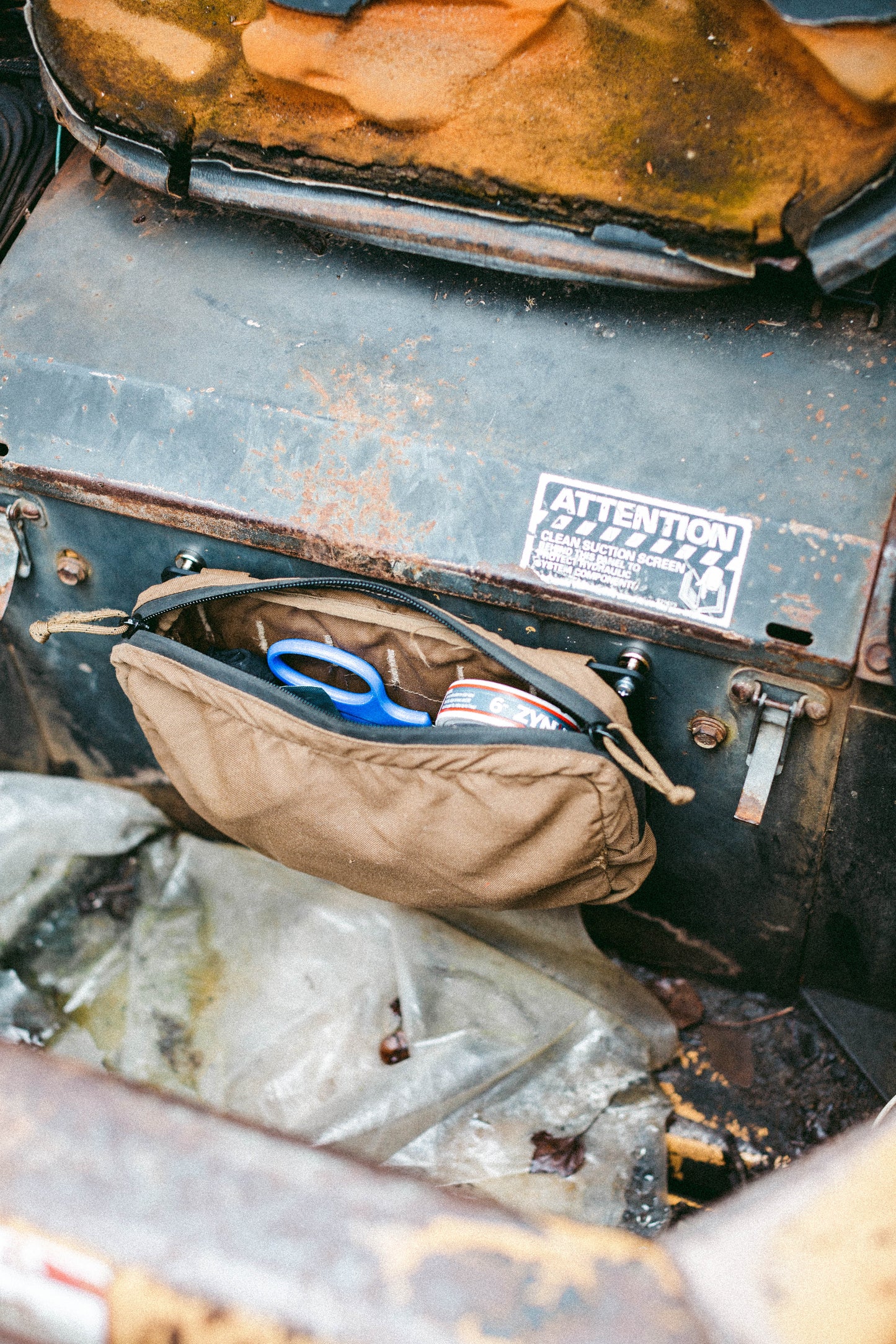 ABS MOLLE panel installed inside a skid steer cab with a mounted GP pouch for tool and gear organization.