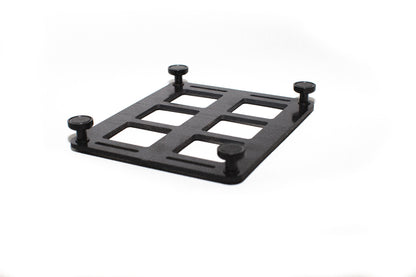 6-slot ABS MOLLE panel flipped upside down to show the magnetic mounting feet attached for securing to metal surfaces.