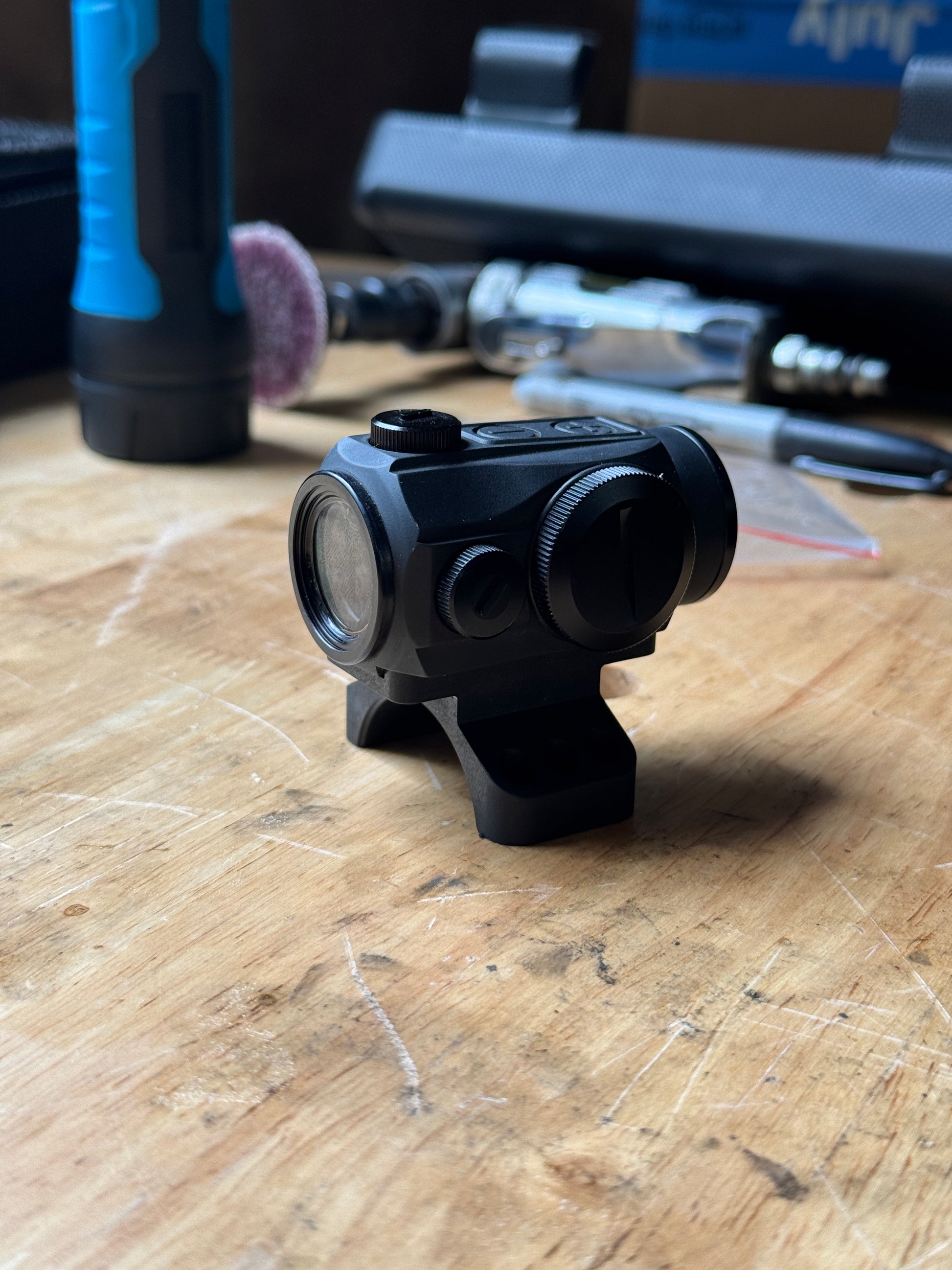 Front angle view of Aimpoint Micro optic installed on the 35mm Badger Ordnance piggyback scope cap adapter