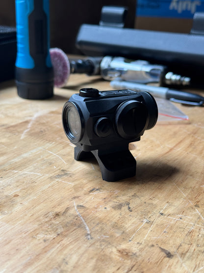 Front angle view of Aimpoint Micro optic installed on the 35mm Badger Ordnance piggyback scope cap adapter