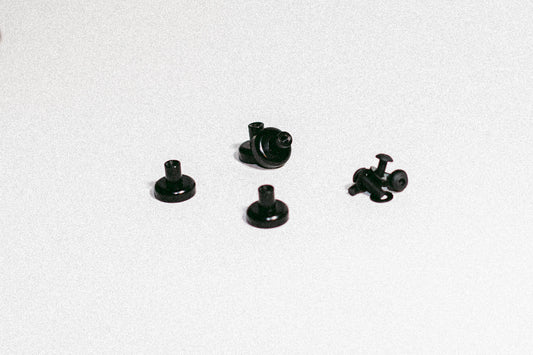 Magnet kit for MOLLE panels including four threaded neodymium pot magnets with black epoxy coating and button-head hardware.