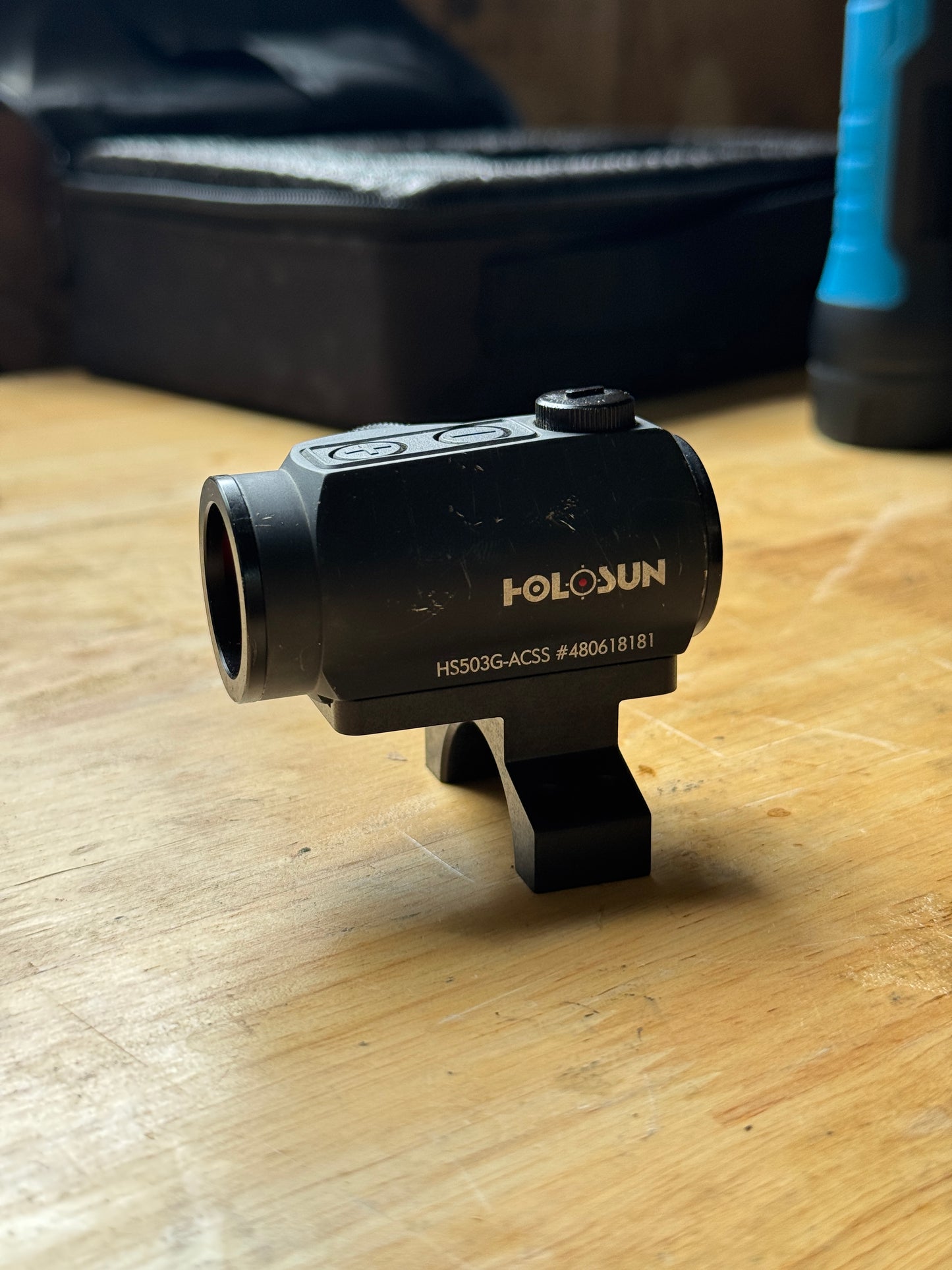 Aimpoint Micro optic mounted on the Vortex 30mm piggyback scope cap adapter during test fit on the workbench.
