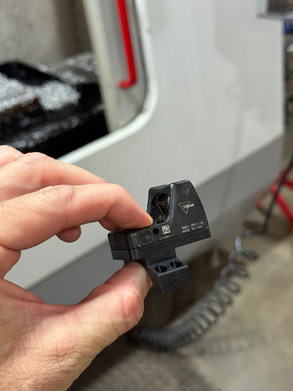 Angled front view of RMR optic installed on Vortex 30mm piggyback scope ring adapter.