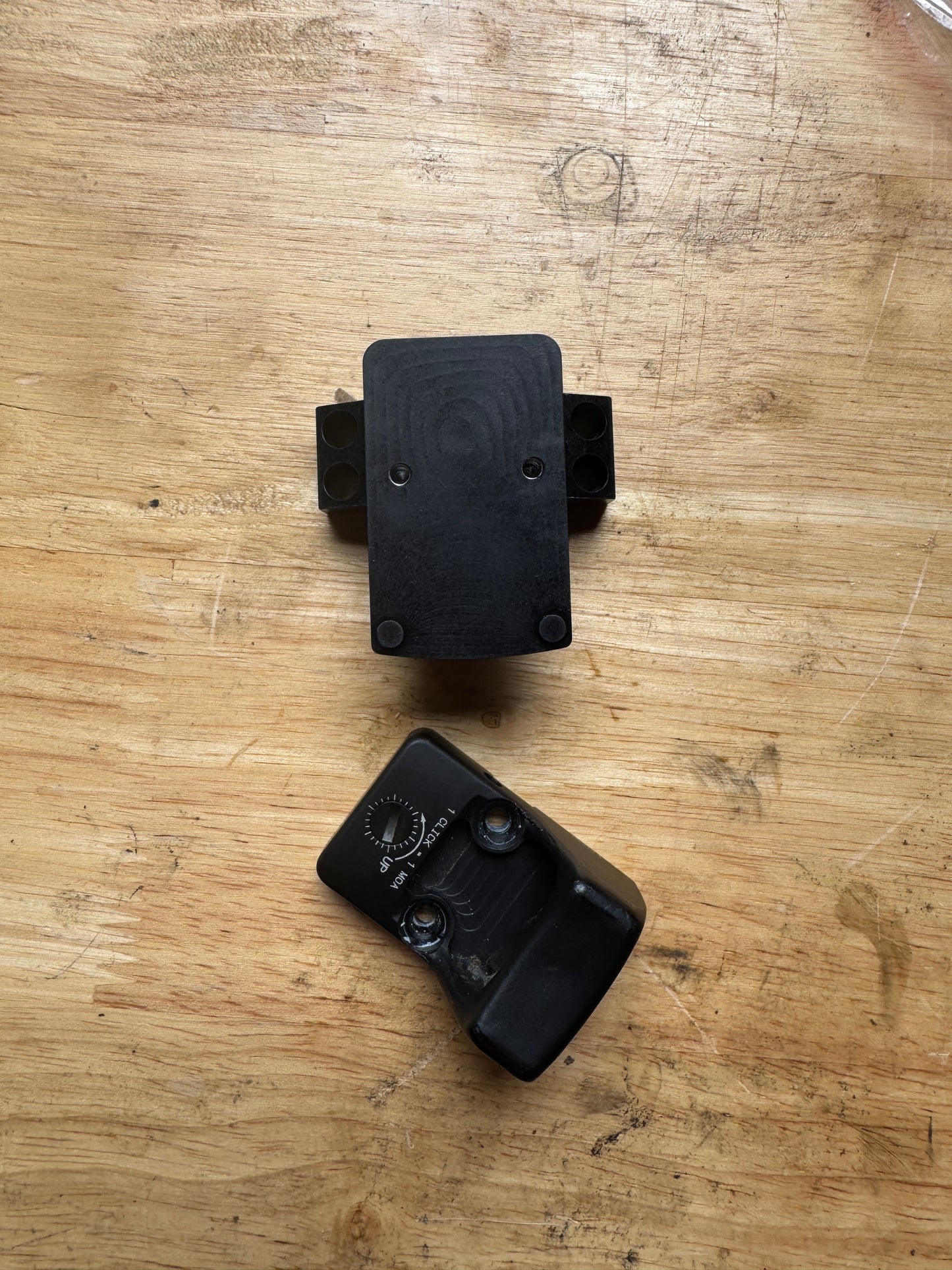 Top-down view of the Vortex 30mm RMR piggyback scope ring adapter showing mounting holes and billet aluminum construction.